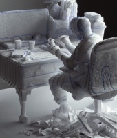 Self-portrait carving at desk